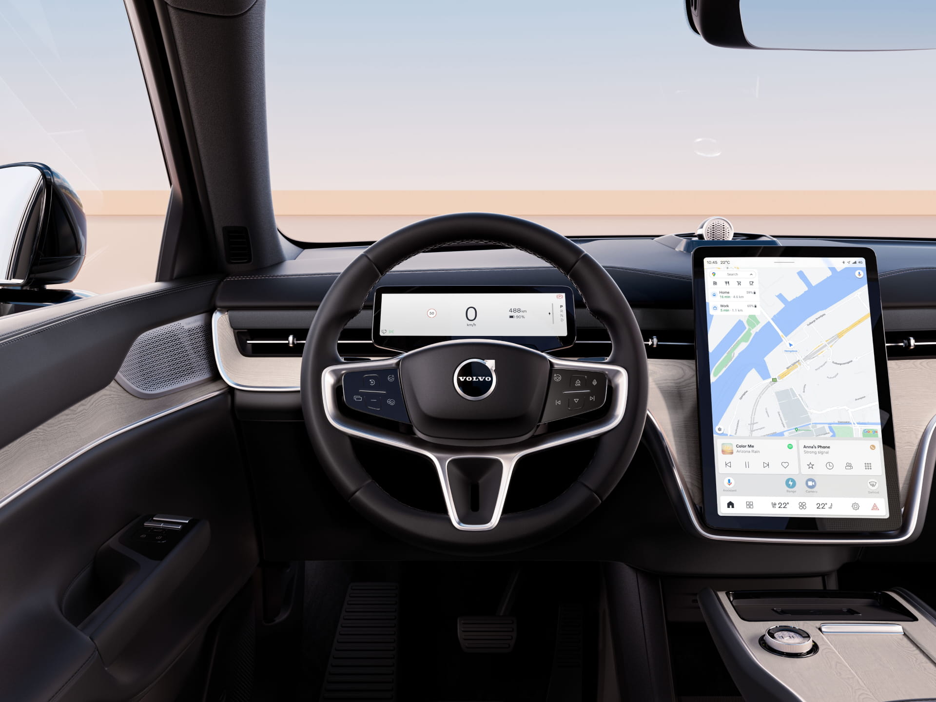 An image showing the steering wheel and sentre display from inside a Volvo EX90.