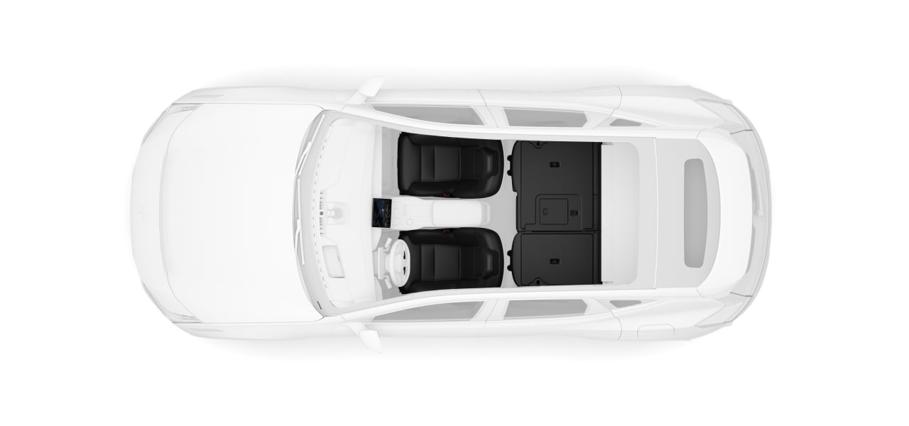 A top-down view of the car with folded rear seats