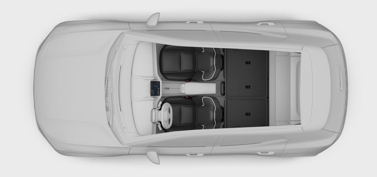 A top-down view of the car with folded rear seats.