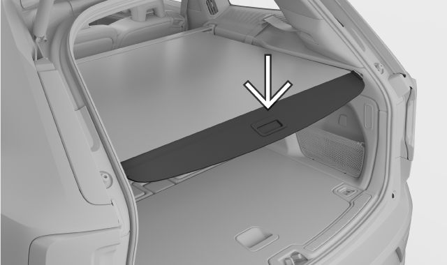 Tilt the load cover downwards to lock it into the grooves.