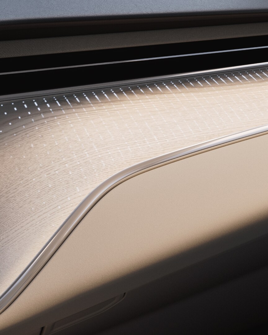 Close-up of the luminous wood décor panels in the Volvo EM90.