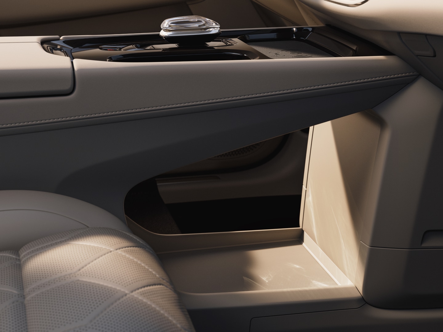 The spacious floor storage unit between the front seats of the Volvo EM90.