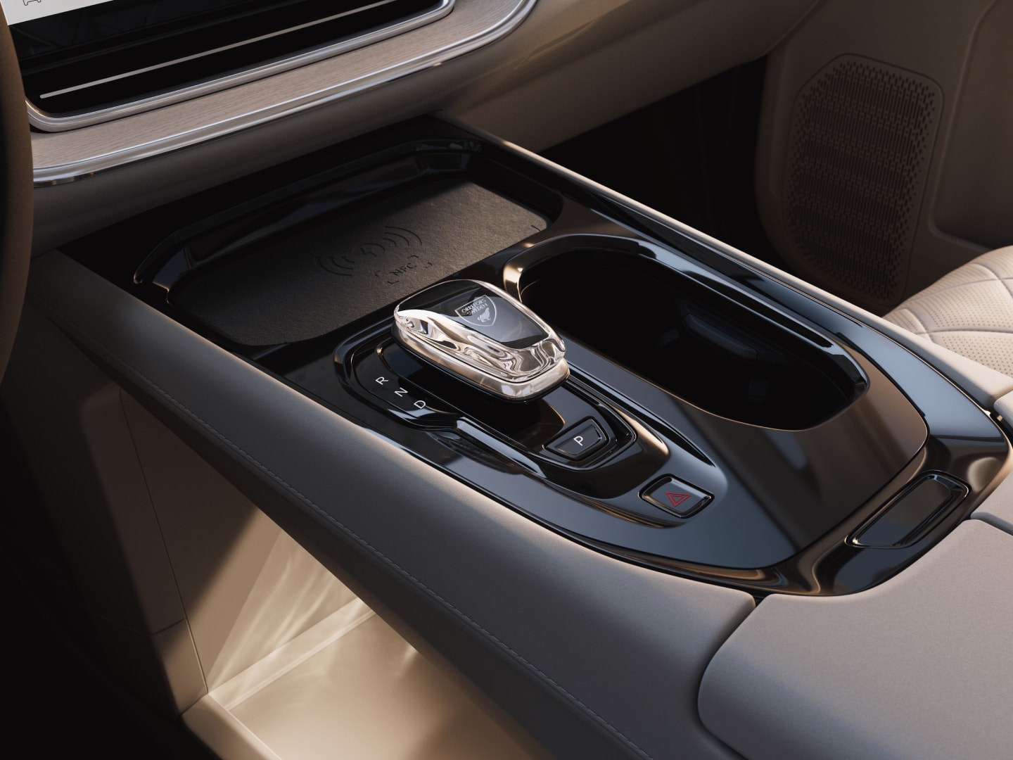 Close-up of the Orrefors crystal gear shift, wireless charger and storage featured in the fully electric EM90.