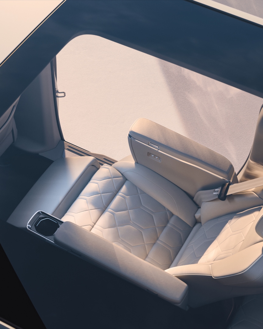 One of the two second-row lounge seats featured in the Volvo EM90 viewed from outside through the panoramic roof.