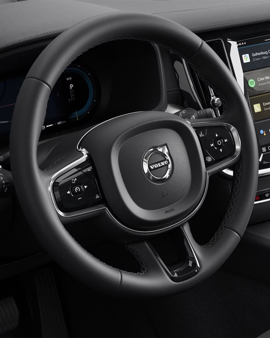 The Volvo S60 mild hybrid’s steering wheel, instrument panel, center console and infotainment touchscreen.