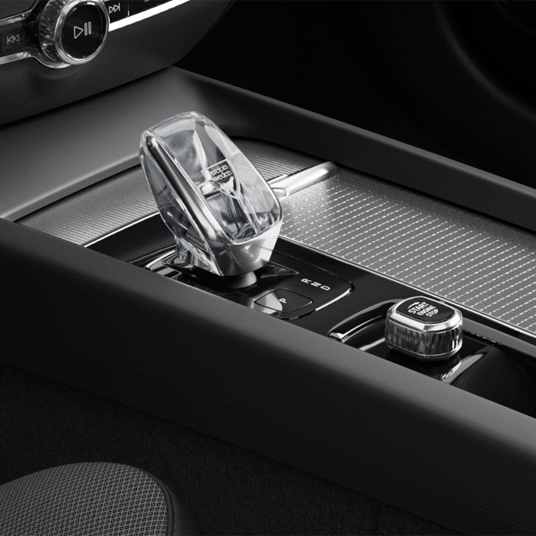 Start button and crystal gear shifter in the metal mesh-trimmed centre console of the Volvo S60 mild hybrid.