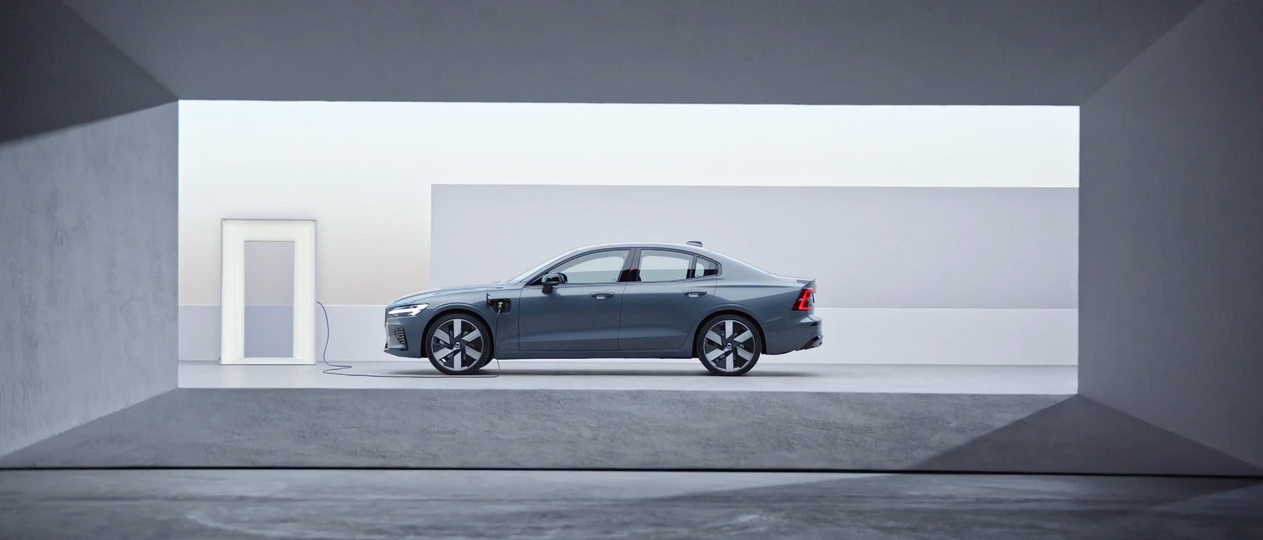 The side profile of a Volvo S60 Recharge plug-in hybrid.