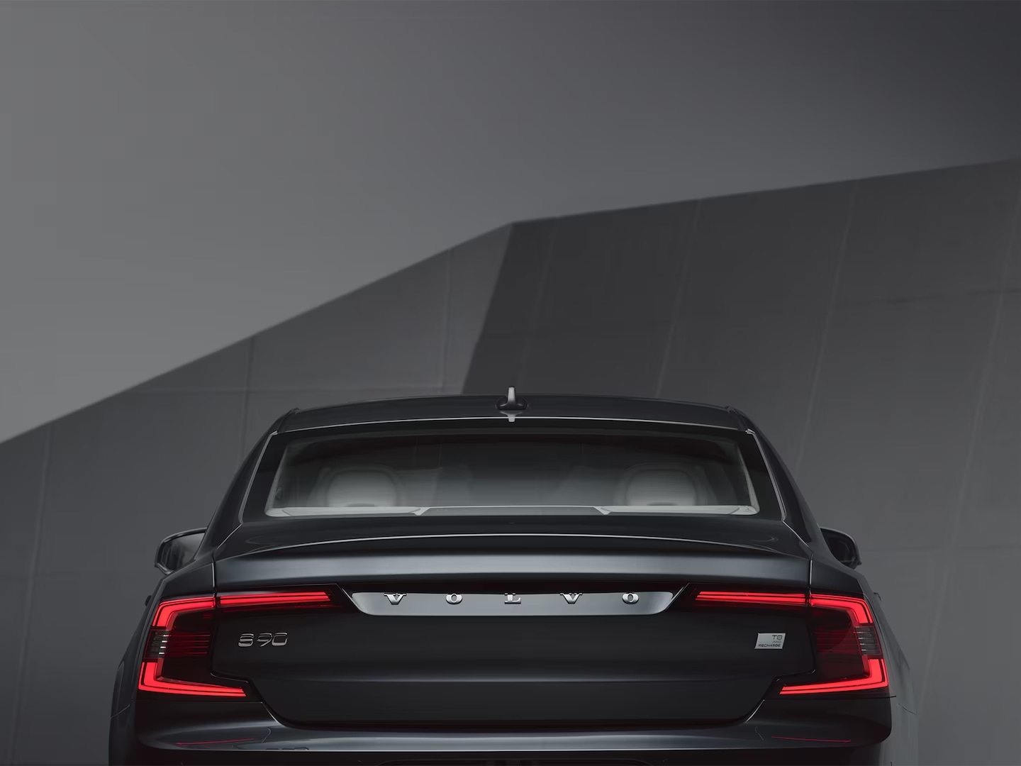 The rear exterior of a Volvo S90 Recharge.
