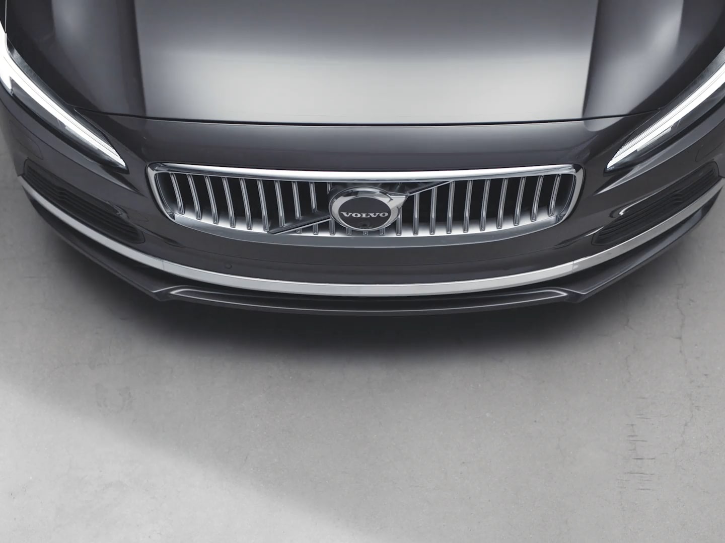 The front exterior of a Volvo S90 Recharge plug-in hybrid.