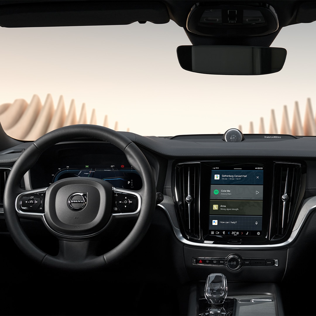 Wide-angle view of the Volvo V60 Cross Country’s dashboard, steering wheel, instrument panel and infotainment screen.