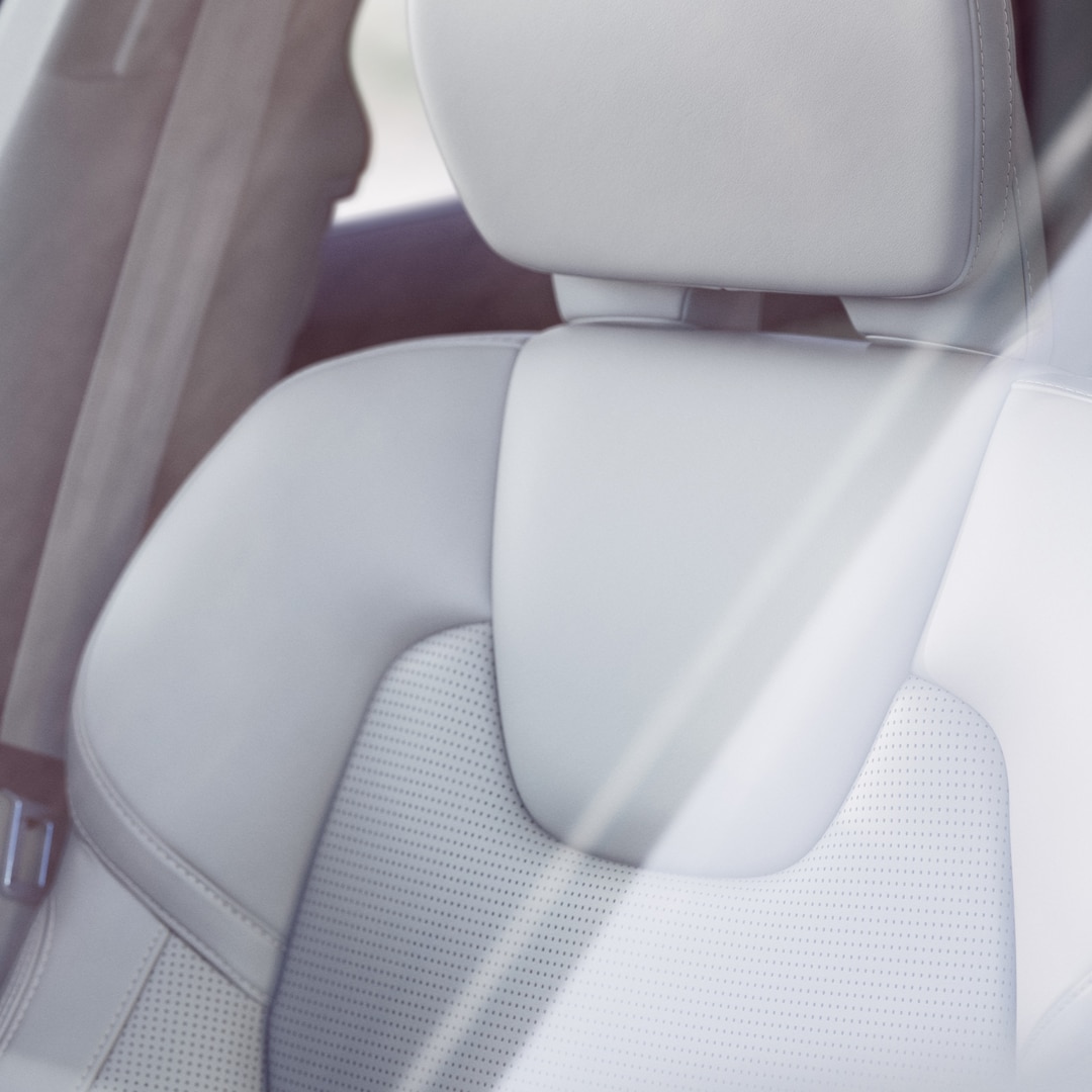 Interior close-up of a leather front seat in a Volvo XC60.