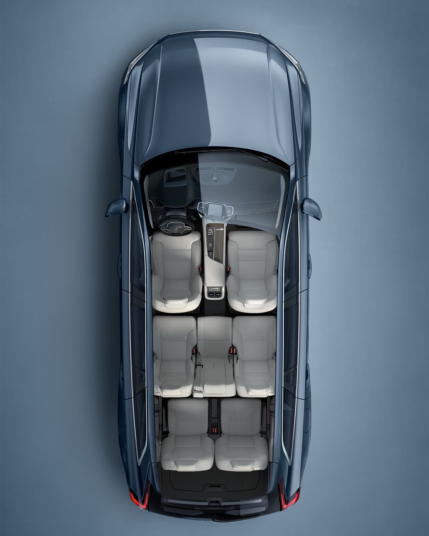 "A white Volvo XC90 SUV seen from directly above with interior visible.