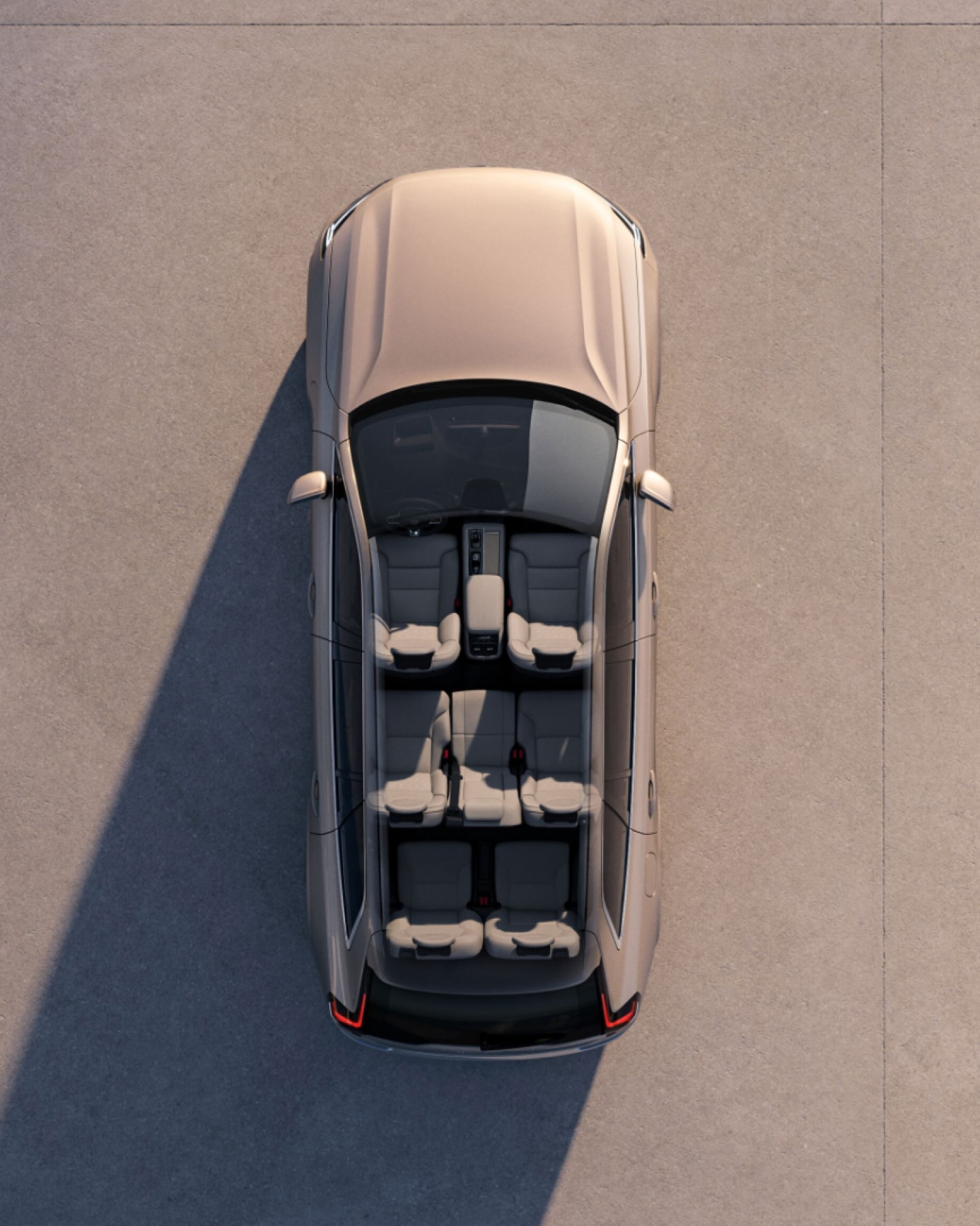 A Volvo XC90 plug-in hybrid seen from directly above with interior visible.