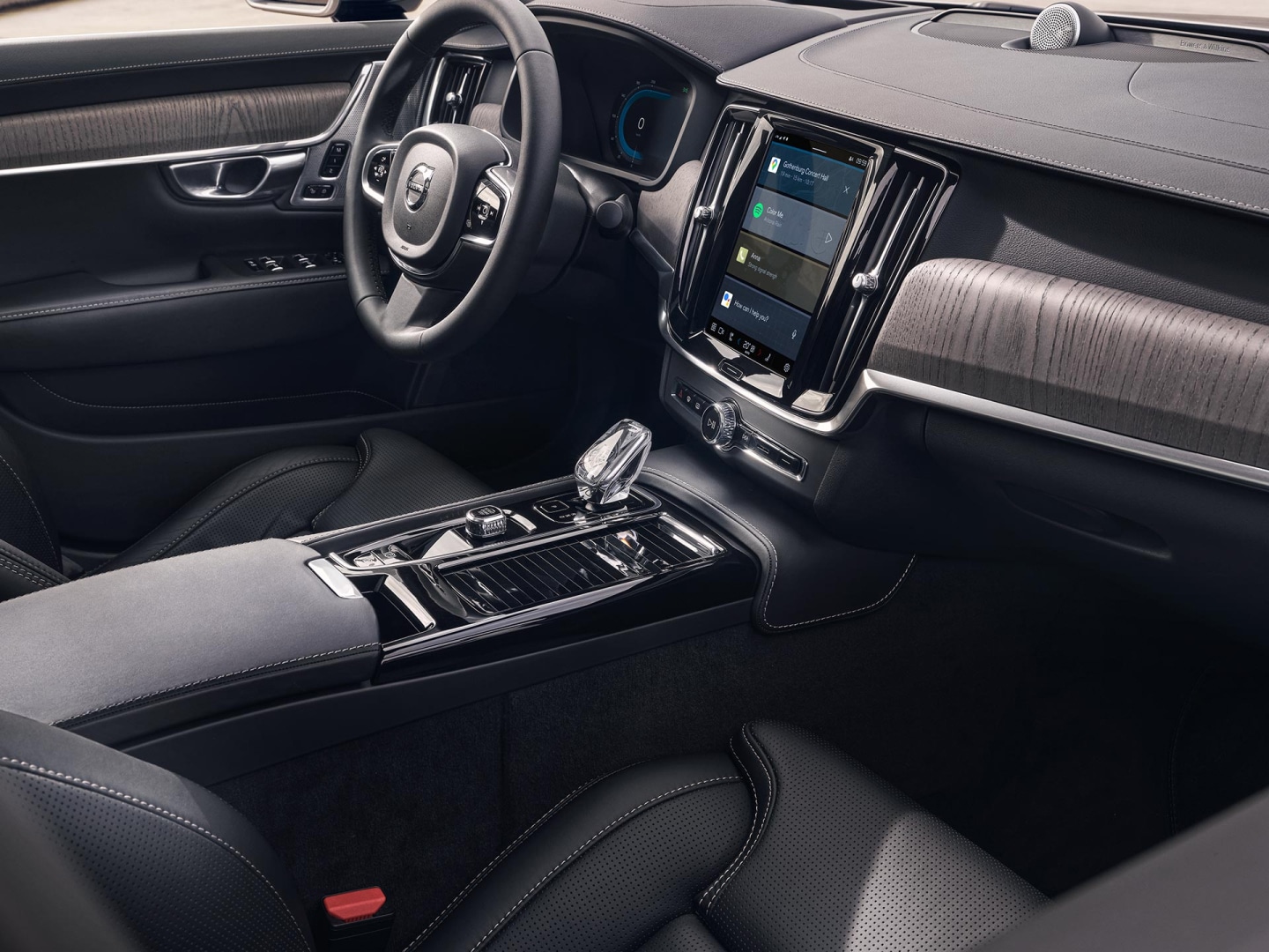 Interior view of the driver's seat, steering wheel and touchscreen centre display from the inside of a Volvo S90.