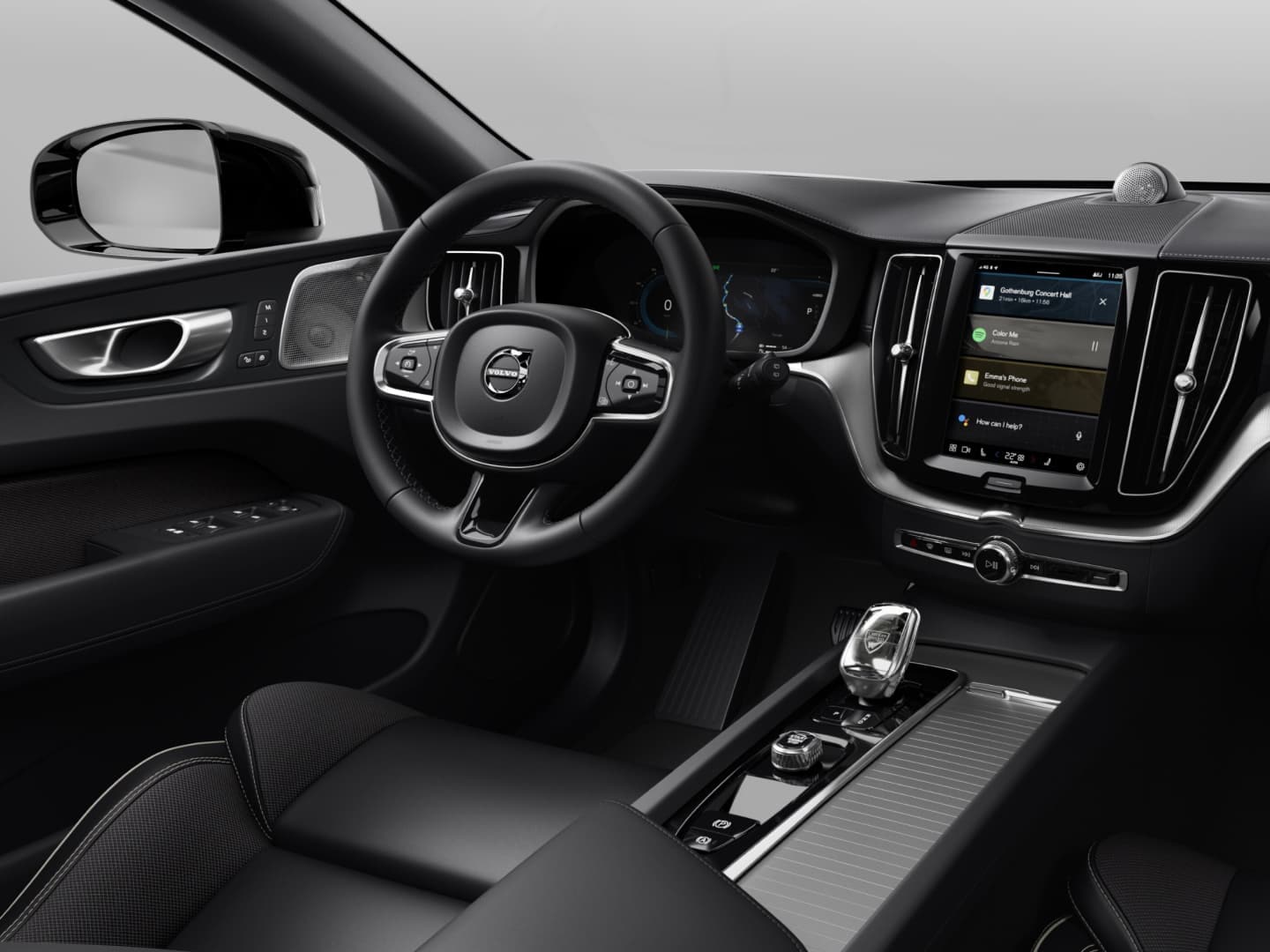 Vedere a interiorului de culoare închisă al modelului Volvo XC60 Black Edition mild hybrid.