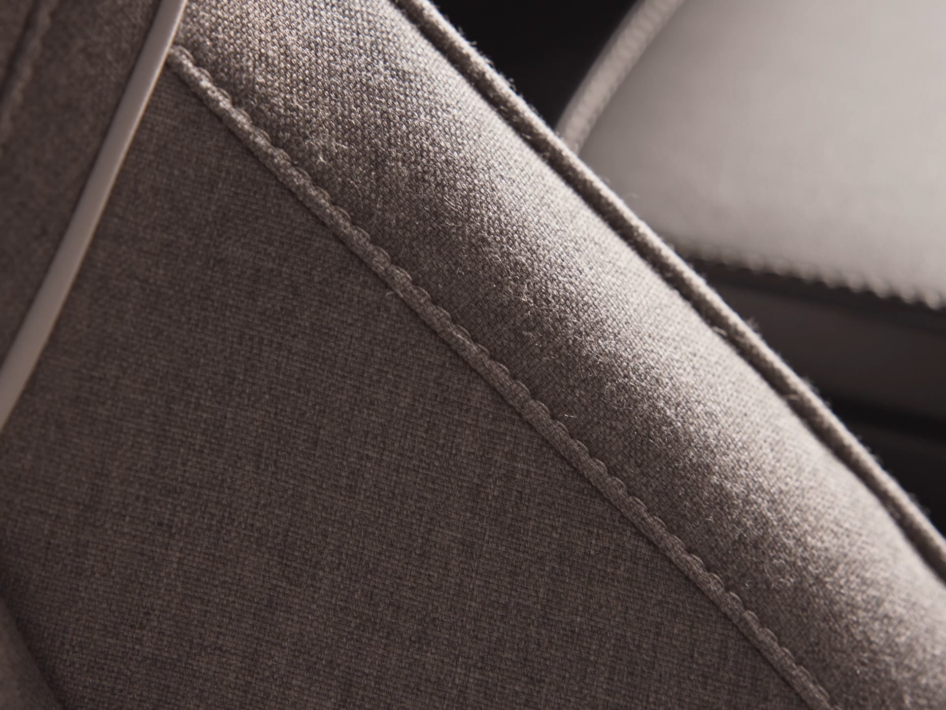 Interior close-up of the leather free Tailored Wool Blend seats in a Volvo V60 Recharge.