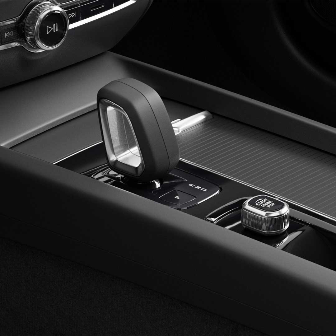 Start button and crystal gear shifter in the black-trimmed centre console of the Volvo S60 mild hybrid.