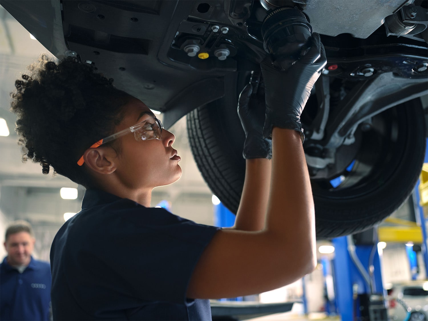 Volvo complementary factory scheduled maintenance - technician working on car 