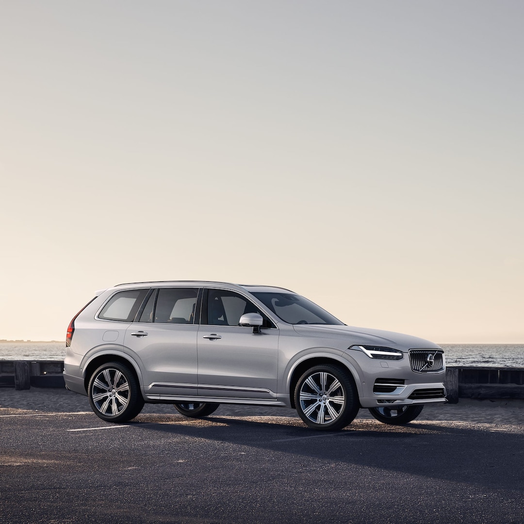 A Volvo XC90 parked along a road by the sea